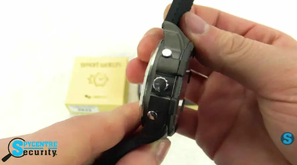 man holding and navigating the buttons of a spy watch