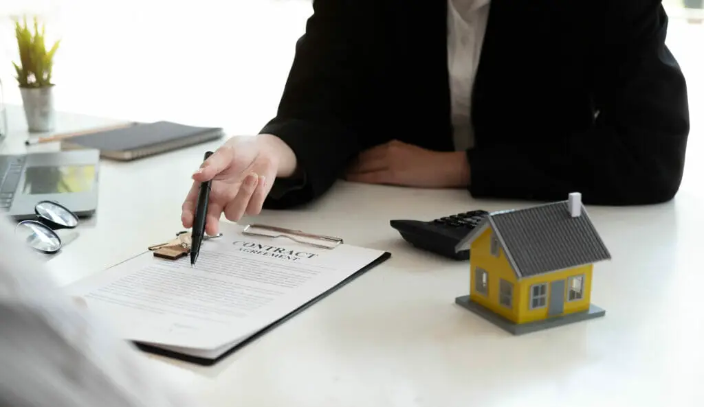 a home agent explaining the contract to a client