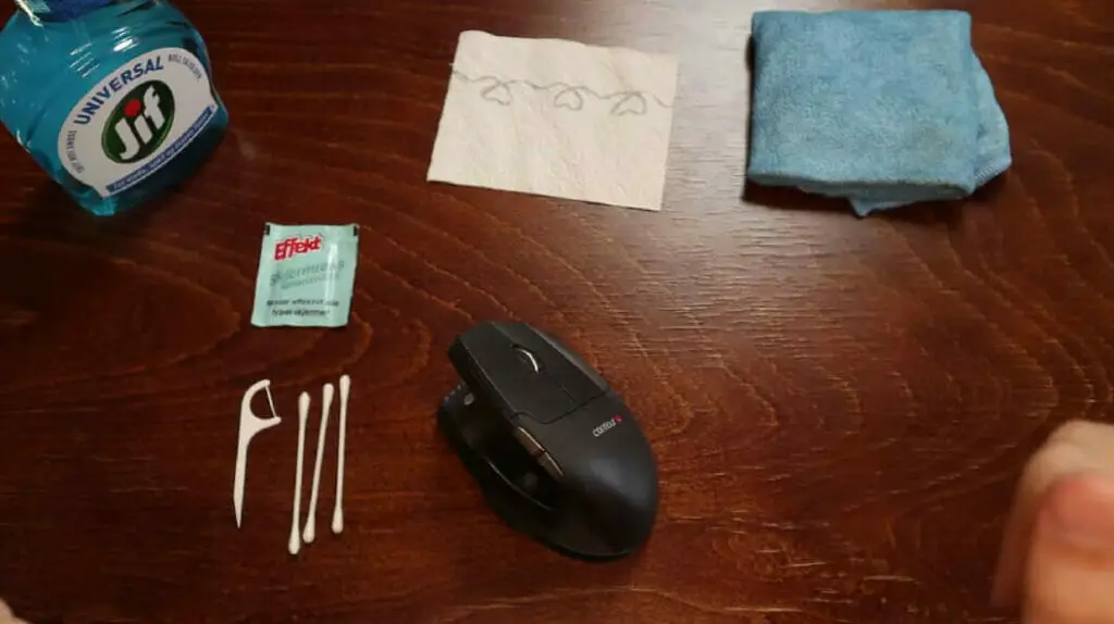 a wireless mouse and cleaning materials