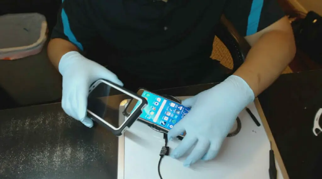 man removing phone case