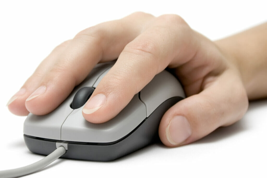 right hand working with a wired mouse