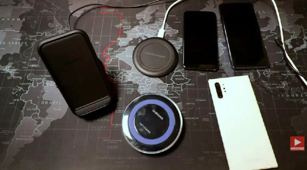 top shot of a samsung wireless charger and 4 other phones