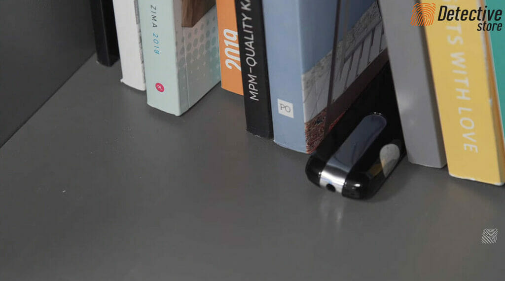 USB spy camera placed in between books