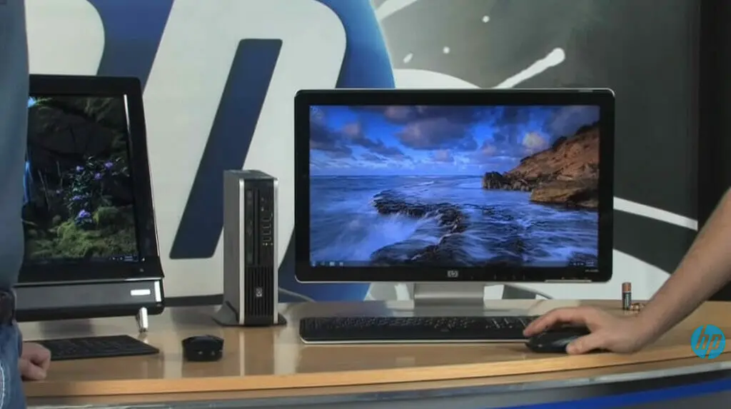 woman using wireless mouse and a MAC desktop