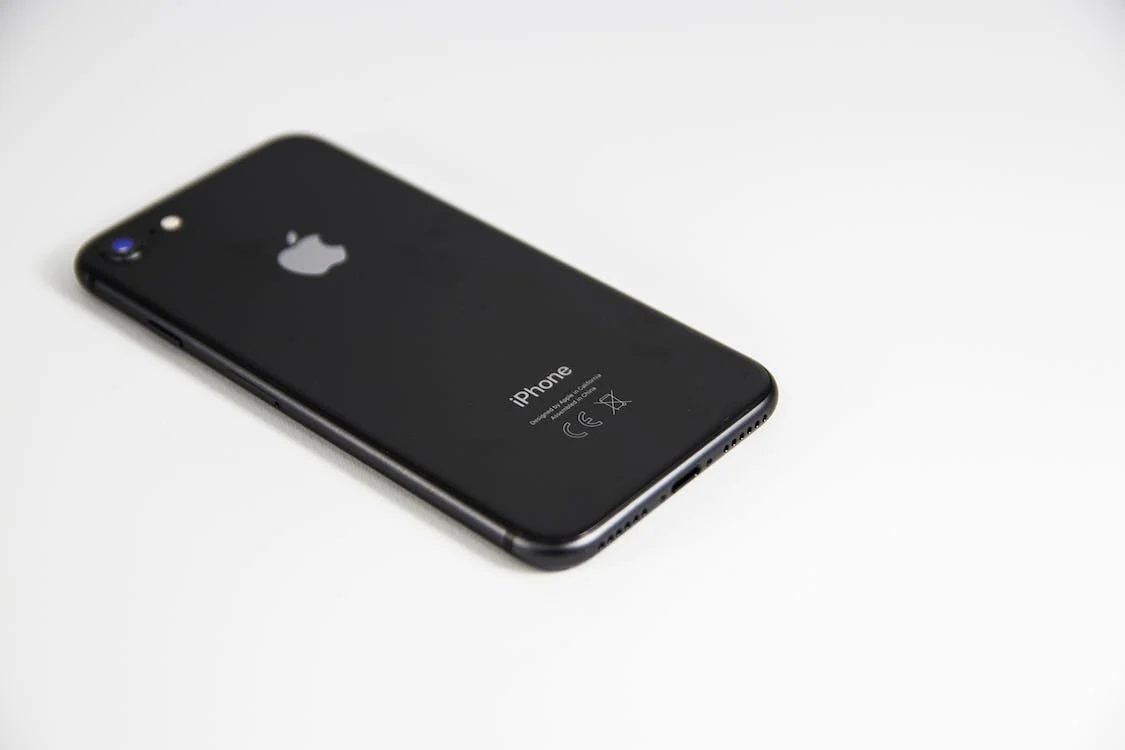 a black iphone in a white background