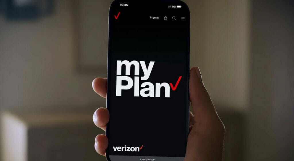a hand holding a phone with a verizon my plan written on it