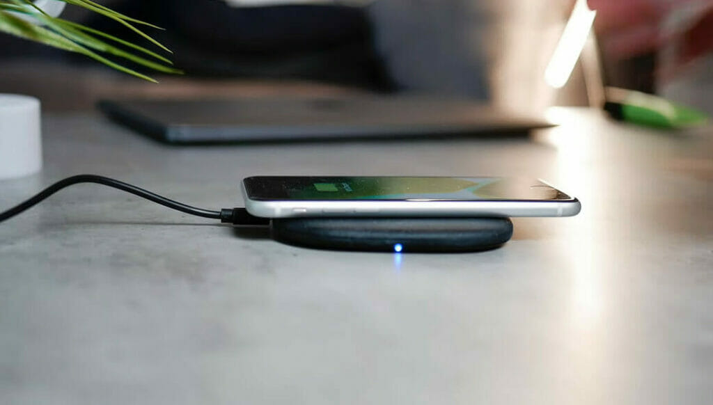 an iphone charge in a wireless charger