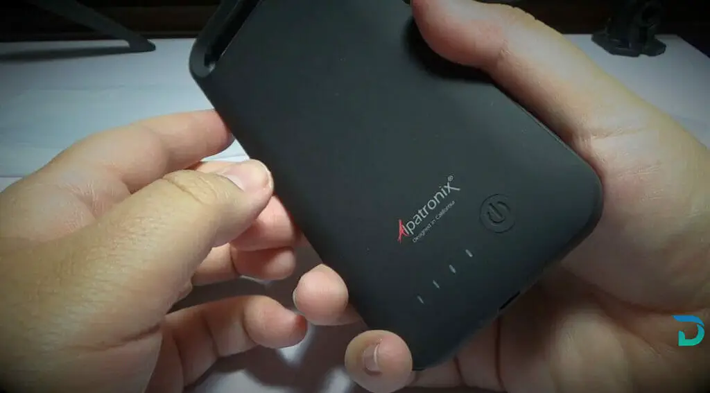 hands holding a wireless charging case