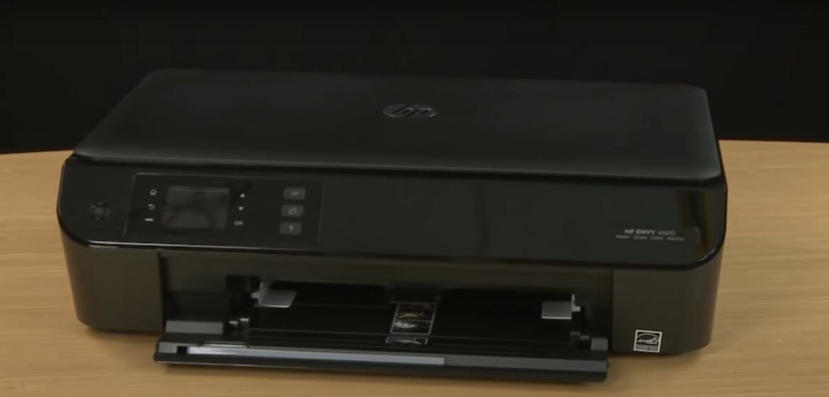 An HP envy printer on a table