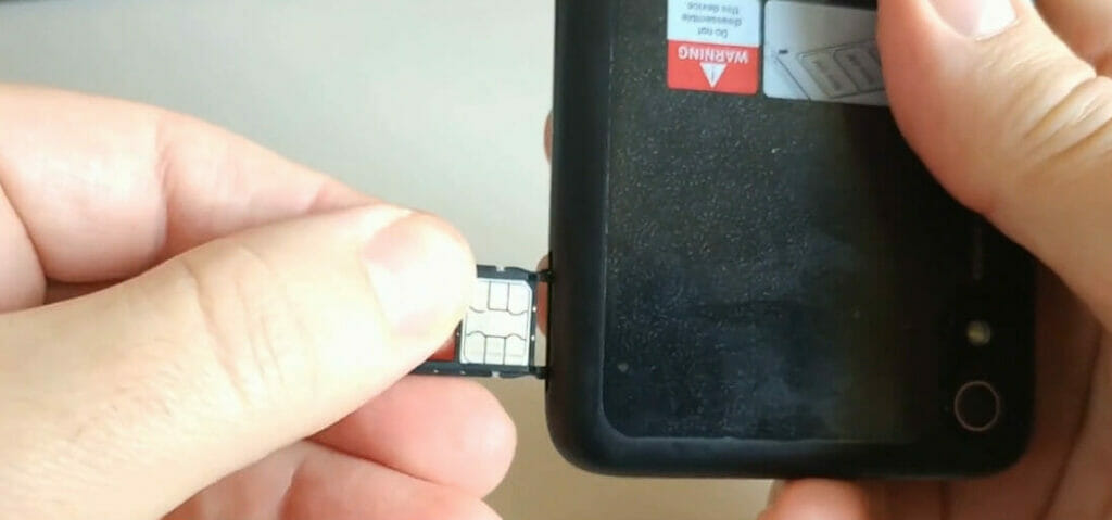 inserting the sim card to the phone's sim card slot