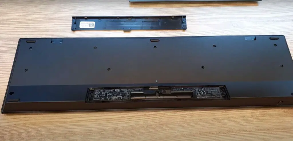 An opened battery compartment of a Dell's wireless keyboard