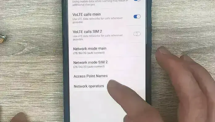 a person tapping on the APN setting on the phone