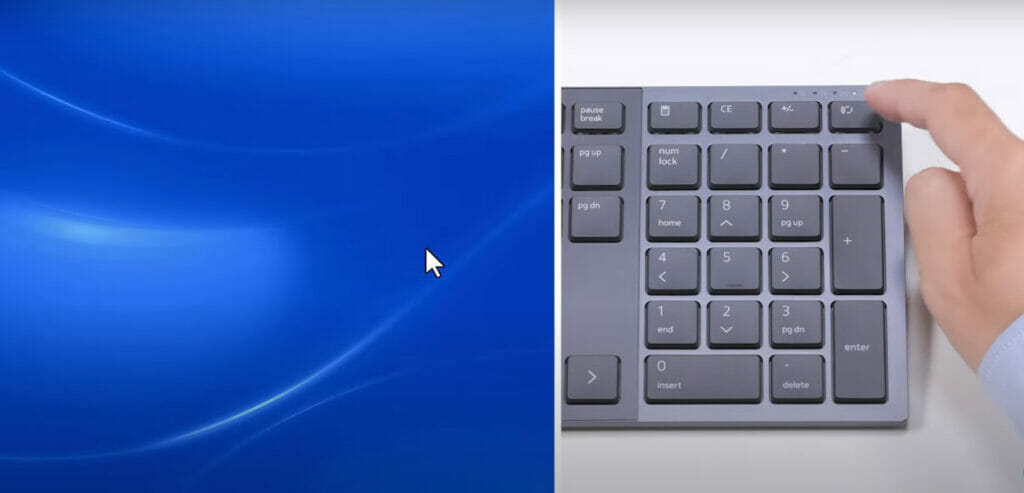 A person pressing Dell's keyboard pairing button