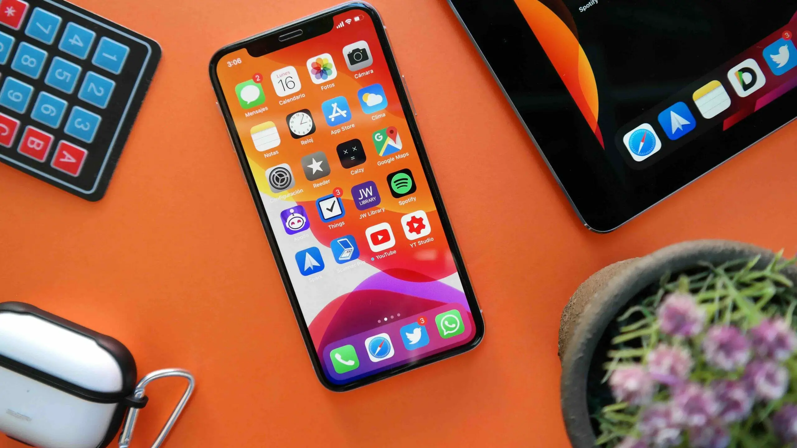 iPhone with iPad on orange background