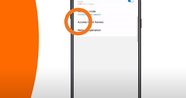 Samsung galaxy s10e with an orange background and a circle on the access point name option