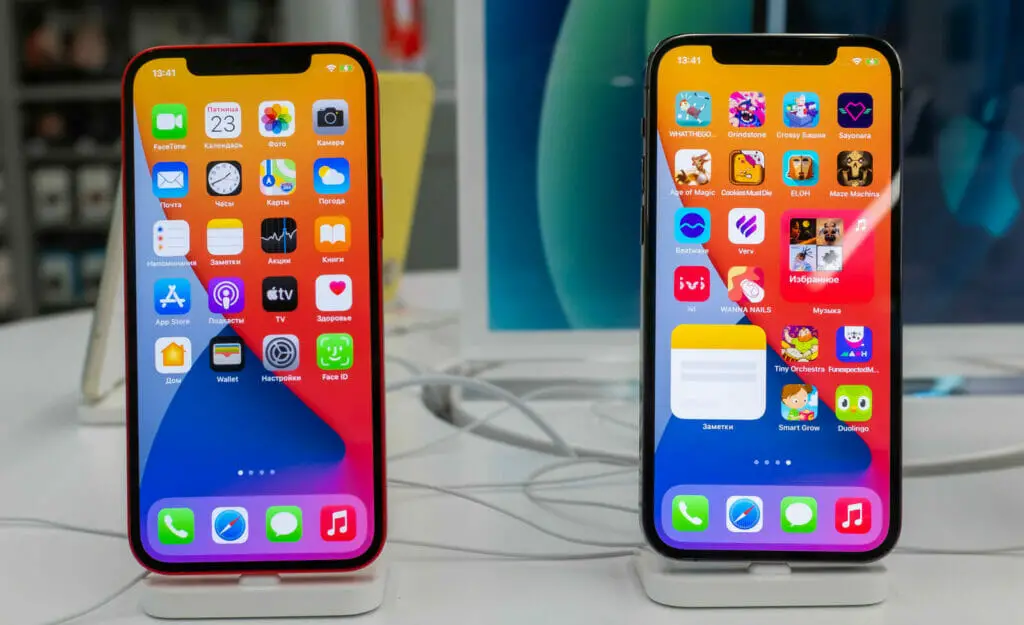 Two iPhones displayed on a table