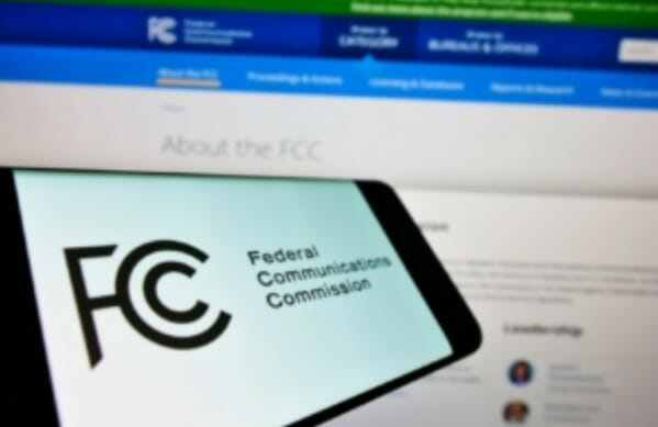 The fcc logo is displayed on a computer screen