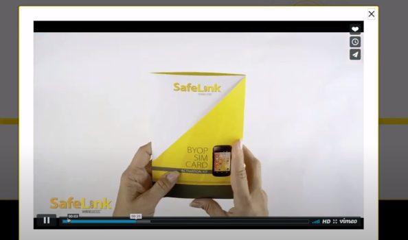 A person is holding a SafeLink sim card