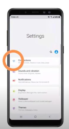 A phone's setting with orange encircling Connections Settings
