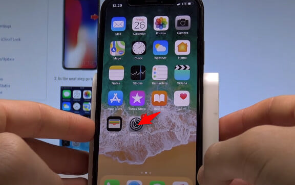 A person is holding up an iphone with an app on it.
