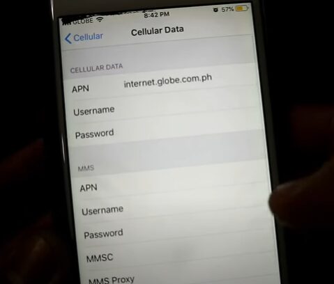 A person editing the APN setting via the Cellular Data setting on the phone