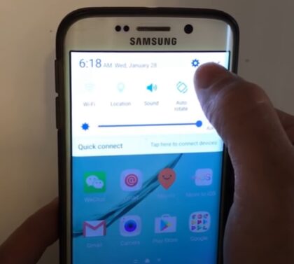 A hand holding a Samsung phone