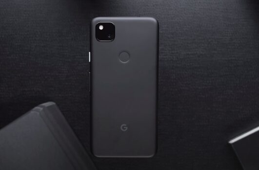 A black Google Pixel phone in a black table