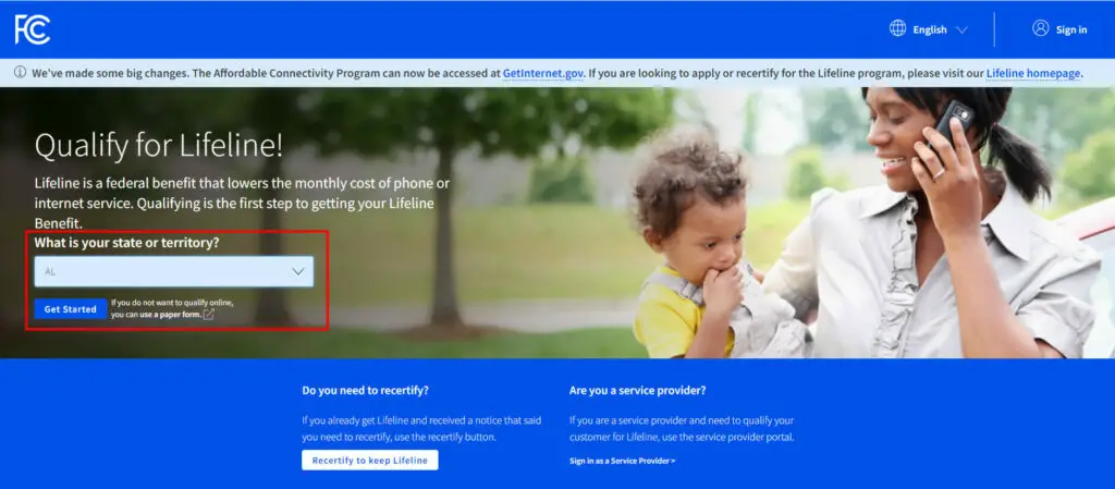 A screenshot of an FC website with a banner of a mom on the phone with her child on her lap
