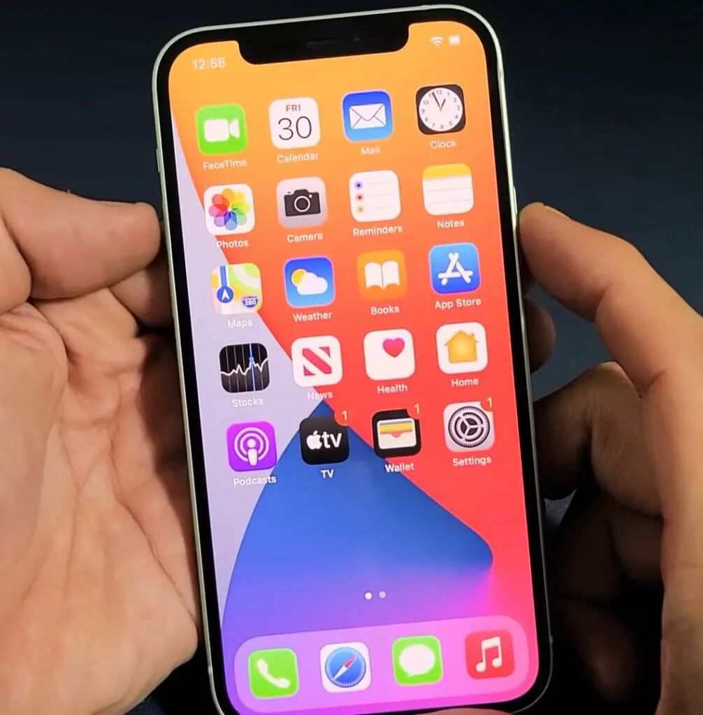 An iphone XR is being held up by a person