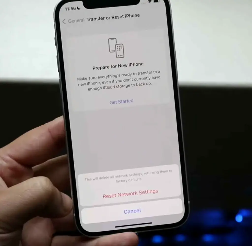 A person is holding an iPhone showing the reset message option
