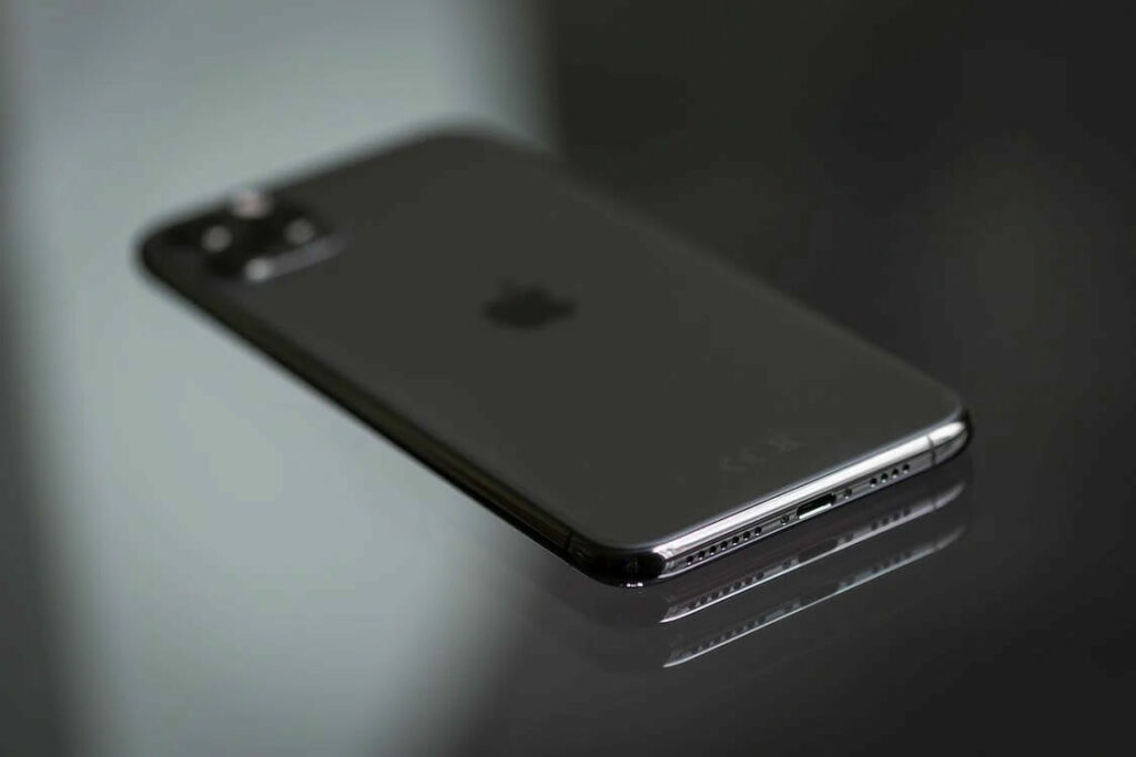 An iphone 11 pro is sitting on a table