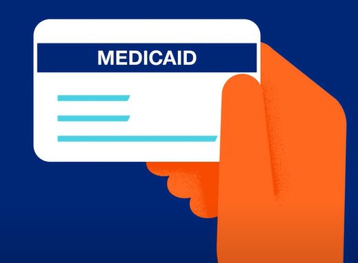 A a hand icon holding up a medicaid card