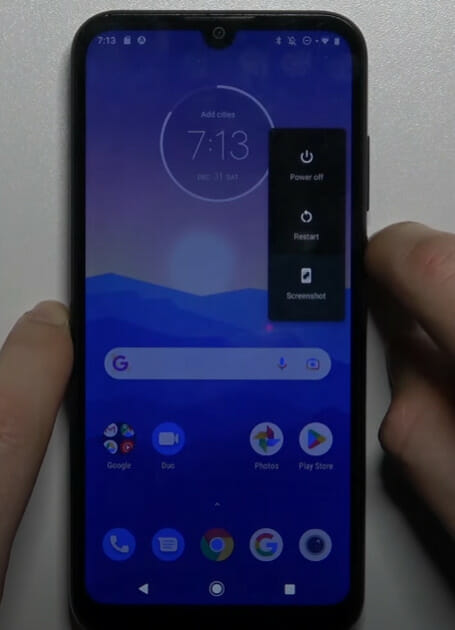 The Motorola Moto G7 is being held by a person