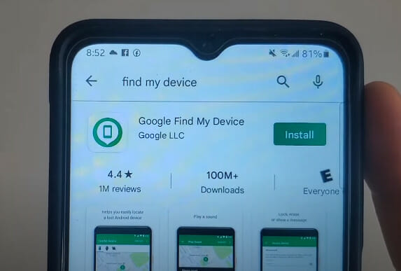 A person holding a phone with the google find my device app on it