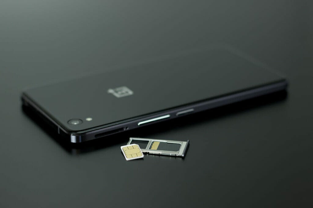 A black phone and a sim card