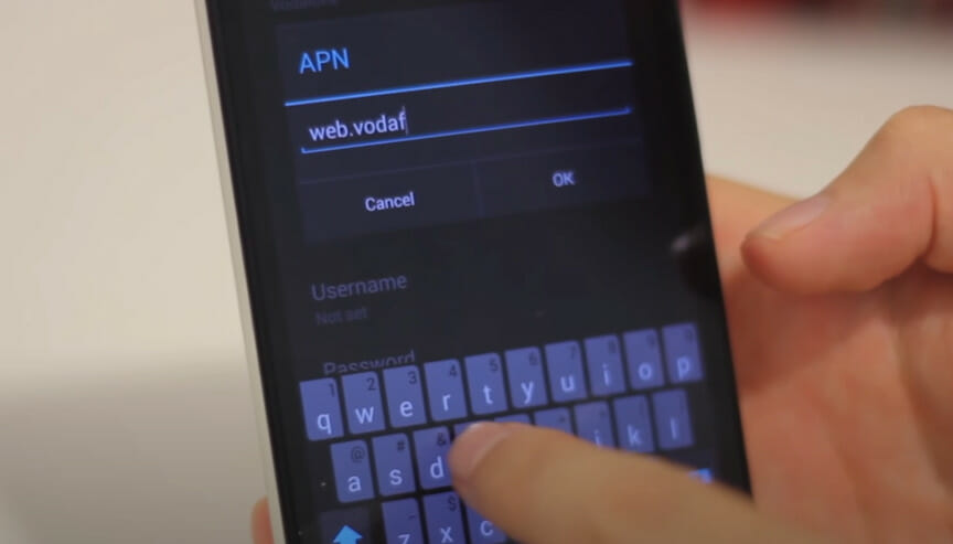A person entering new APN setting on the phone