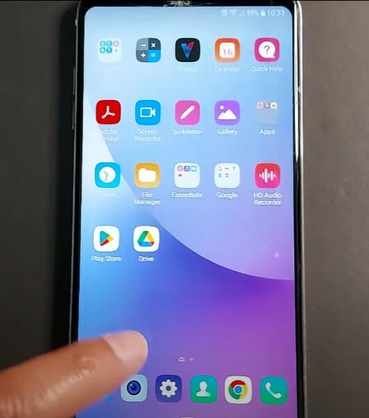A person tapping on the homescreen of his phone