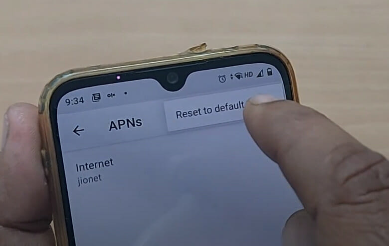 A person Resetting the APN to default