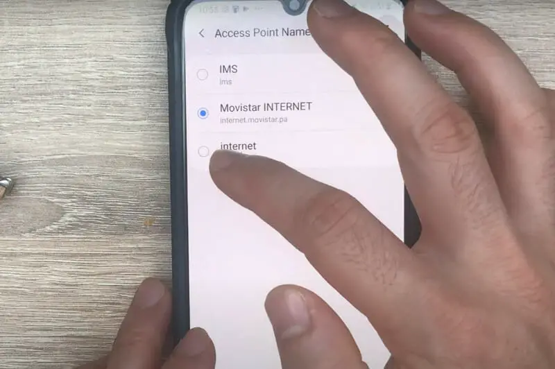 A person tapping on internet option on the APN phone's setting