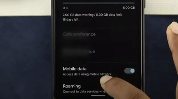 A person enabling Mobile data on the phone