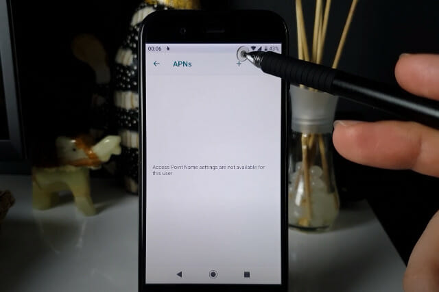 A person is using a digital pen to add information on the APN setting