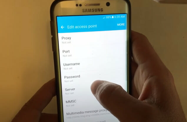 A person editing the access point names settings of a phone
