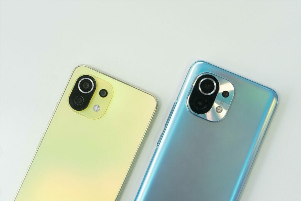 Two phones; neon yellow and blue