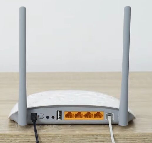 TP Link DSL router at the top of a table