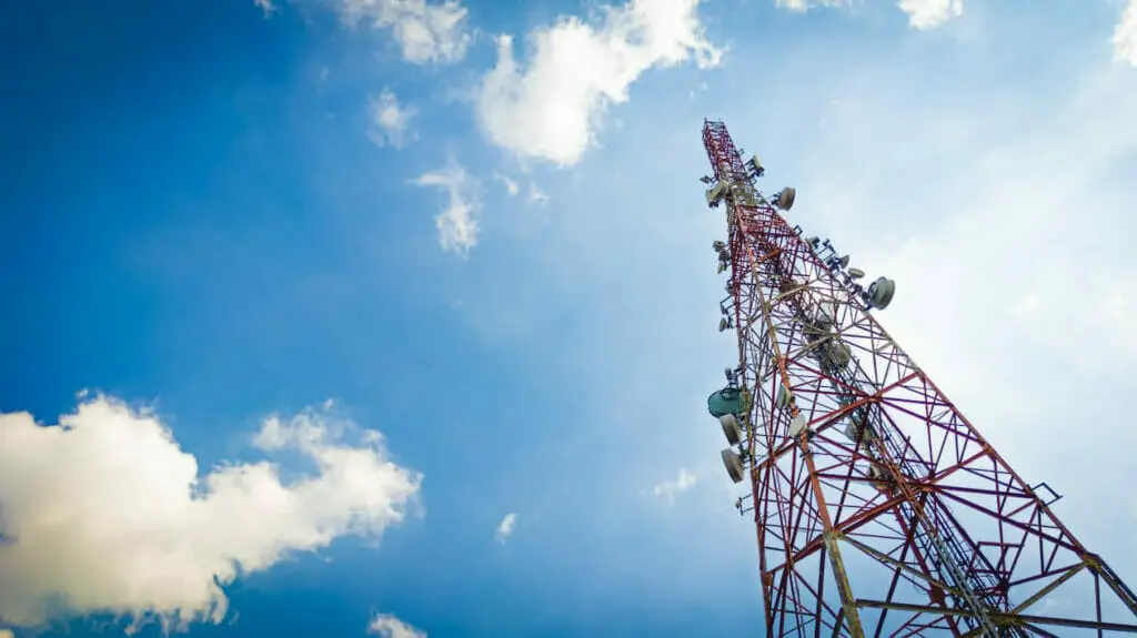 A telecommunication tower against a blue sky