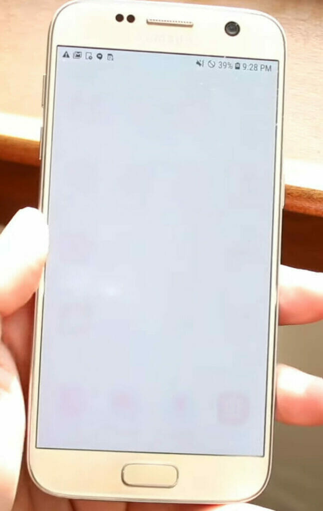 A person holding a white phone