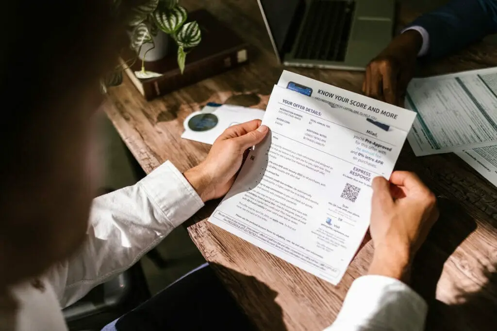 A man reviewing documents on his desk