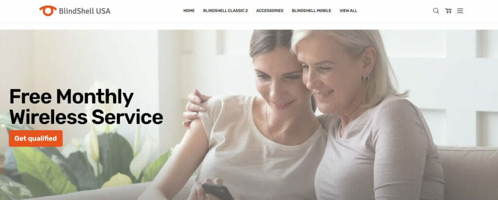 BlindShellUSA website screenshot with two women sitting in the couch banner and has a text that says: Free Monthly Wireless Service